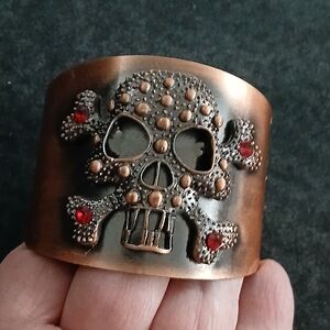 Copper Toned Studded Skull and Crossbones Cuff Bracelet w/ Red Rhinestone Jewels